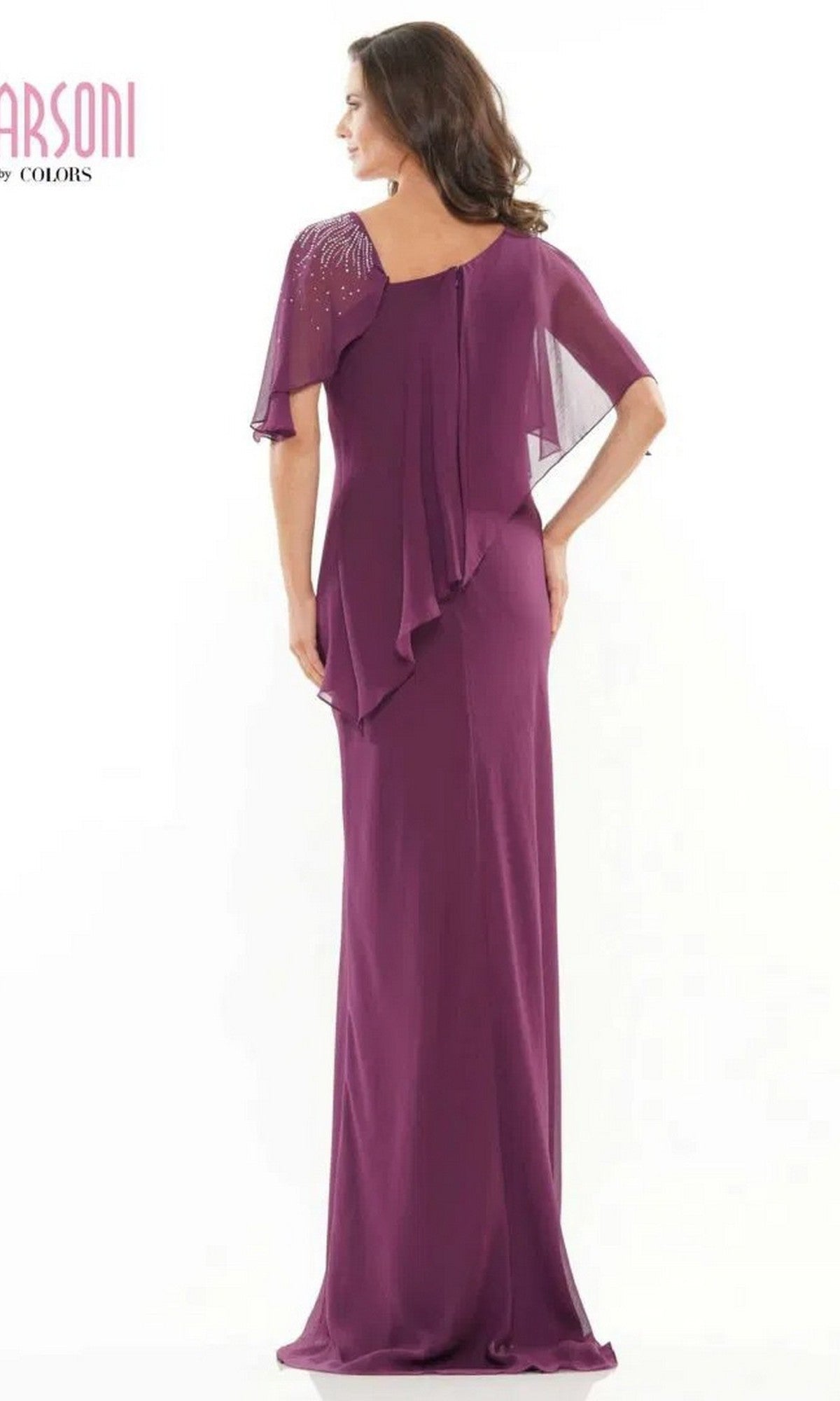 A woman wearing the Marsoni M313 long formal dress, featuring floor-length chiffon, sheer beaded sleeves, and a layered back detail, stands facing away from the camera.